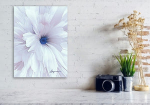 a picture of a white flower on a white brick wall