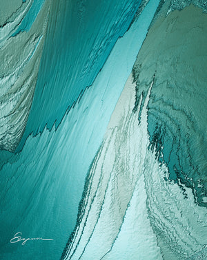 a close up view of a blue and green water